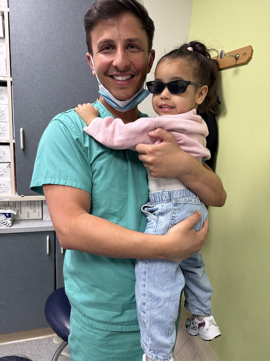 Dr. Shiloah with patients, moment 11
