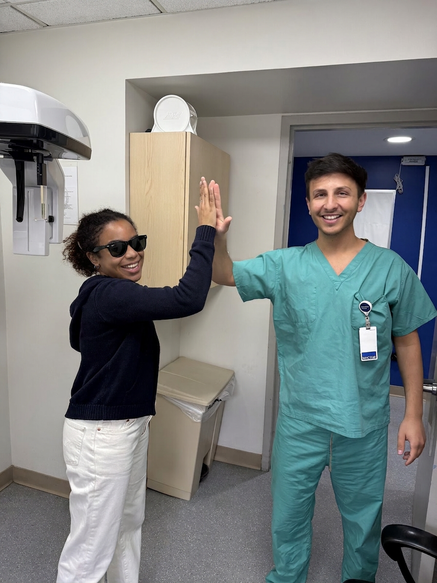 Dr. Shiloah with patients, moment 15