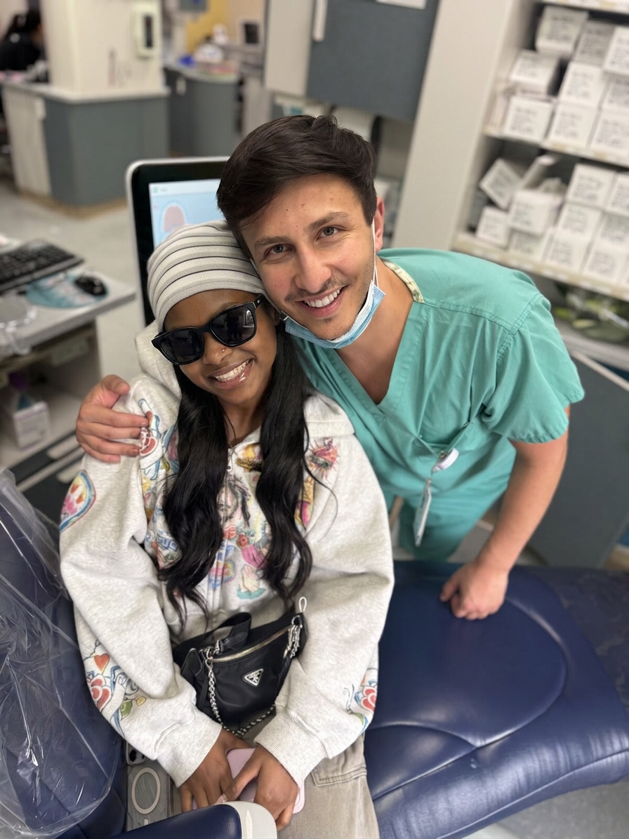Dr. Shiloah with patients, moment 17