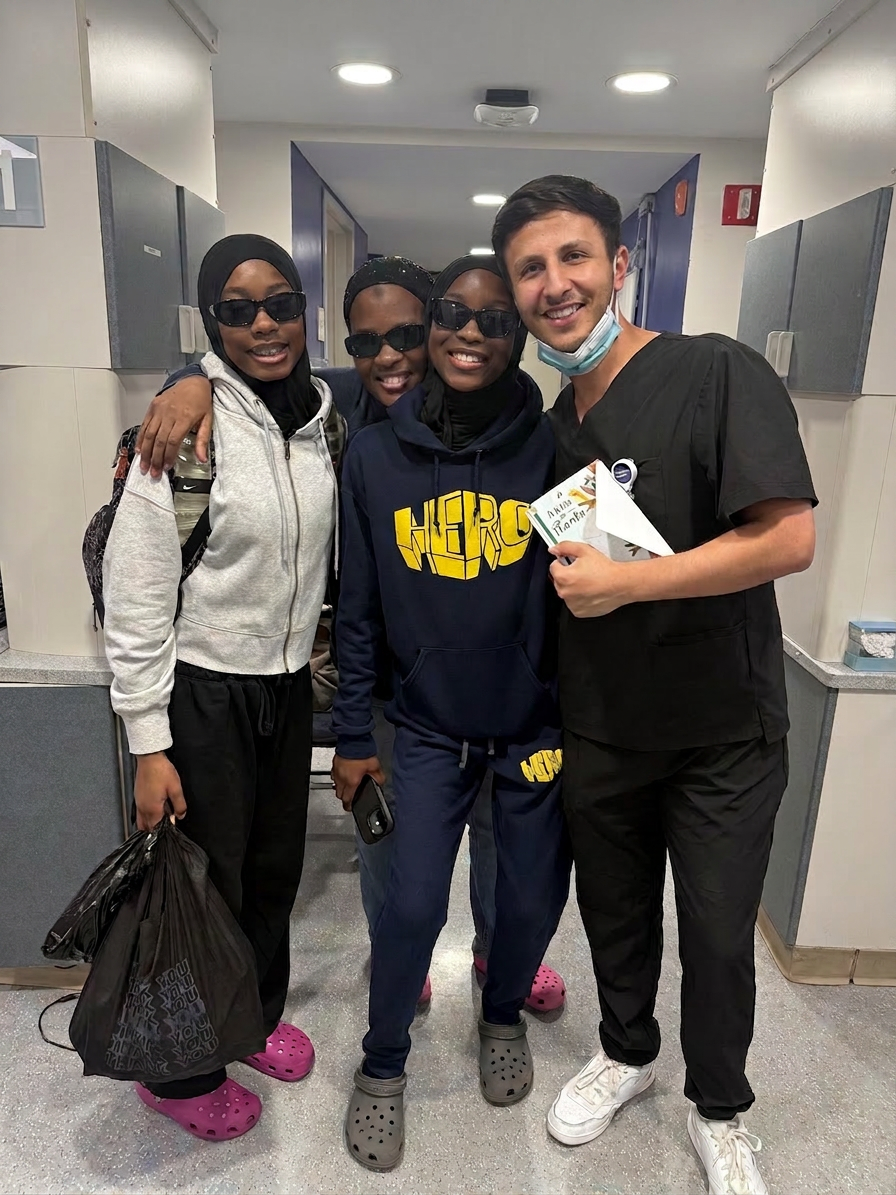 Dr. Shiloah with patients, moment 2