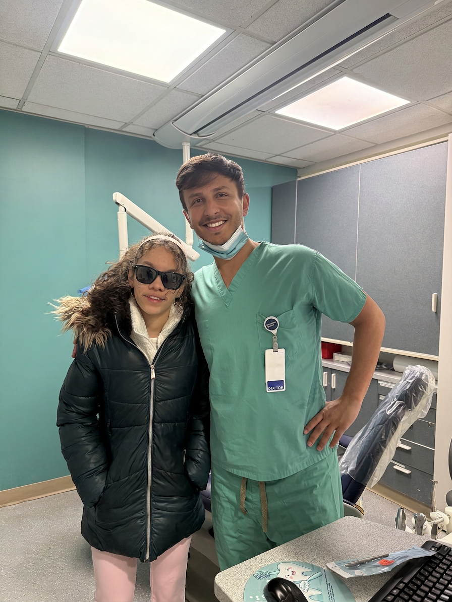Dr. Shiloah with patients, moment 8